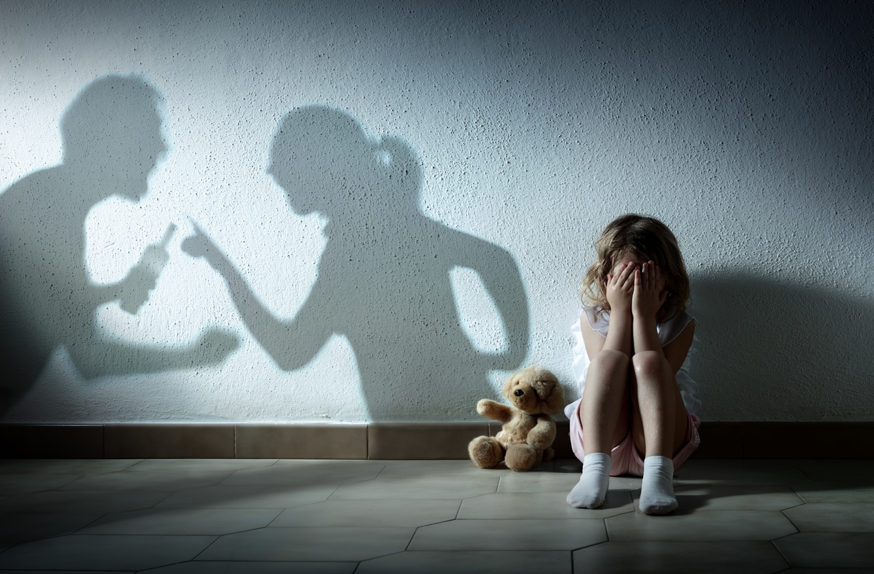 Free Resources 2 A heated argument depicted by shadows on a wall aside a small girl with her hands on face in sadness, and Teddy bear for comfort. This is only one of many impacts to a family when alcohol becomes habitual.